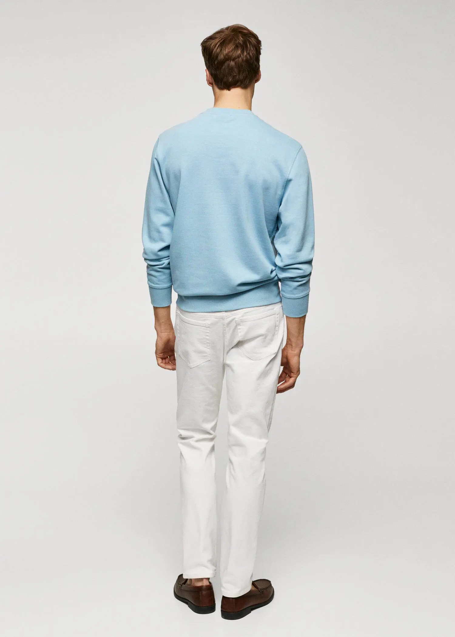 Mango 100% cotton basic sweatshirt . a man wearing a light blue sweater and white pants. 