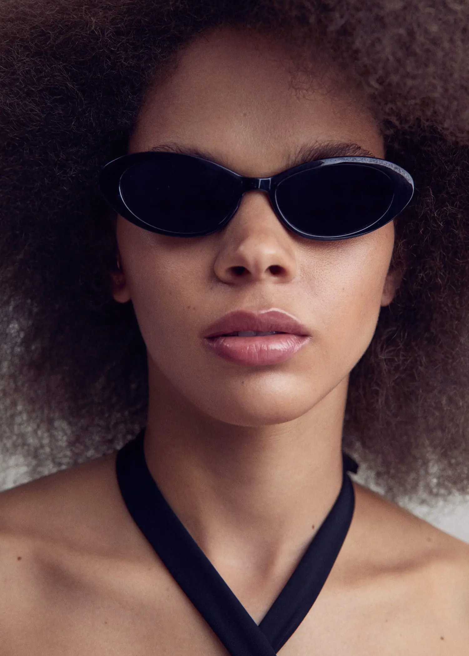 Mango Oval sunglasses. a close up of a person wearing sunglasses. 