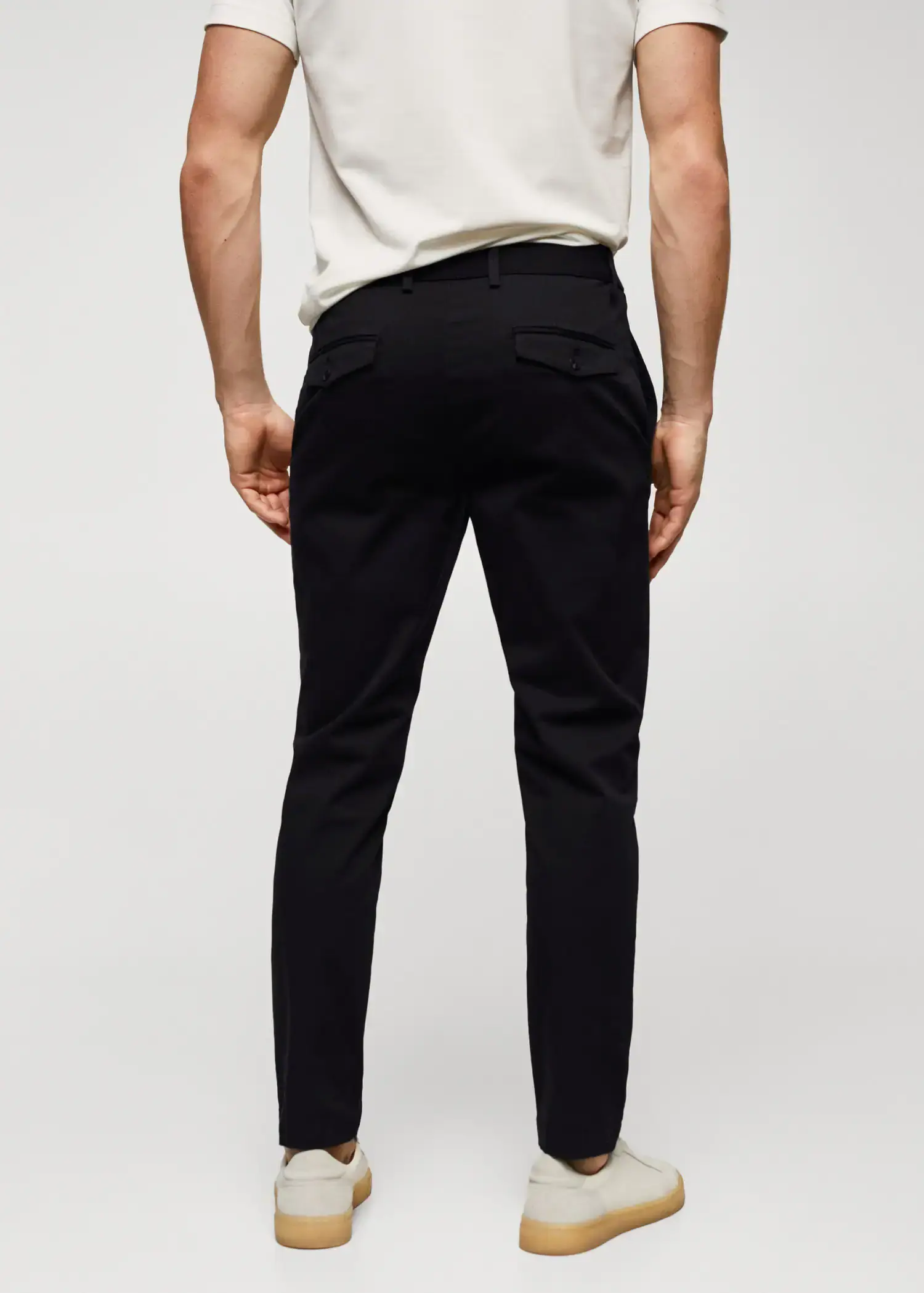 Mango Cotton tapered crop pants. a man wearing black pants and a white t-shirt. 