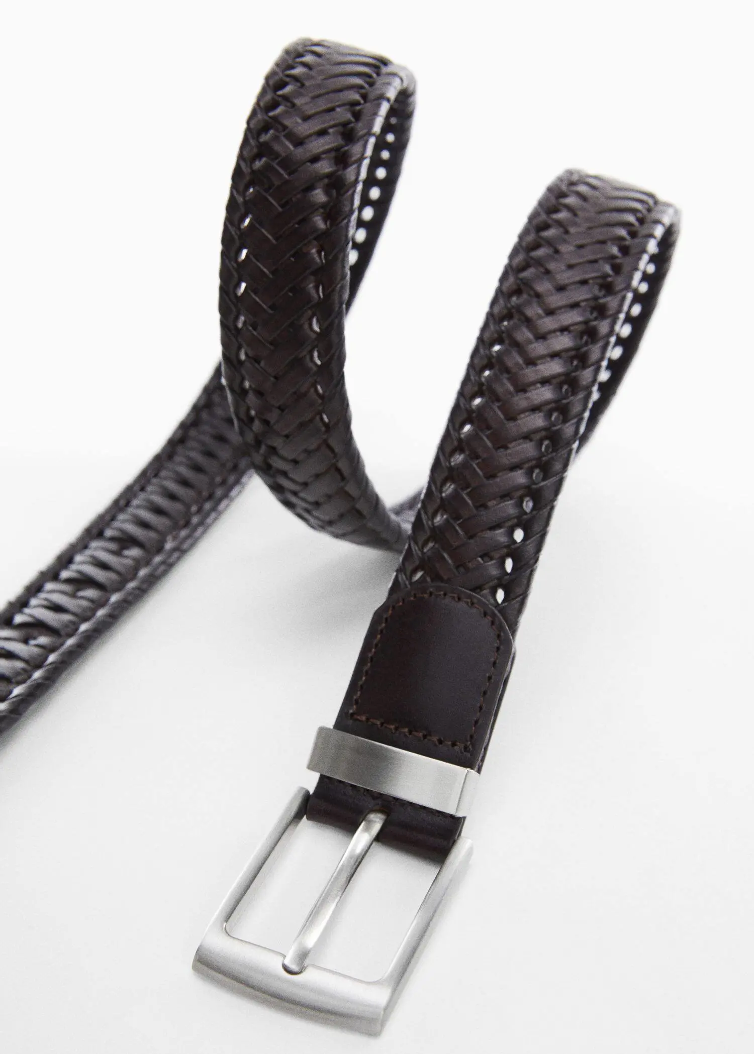 Mango Braided leather belt. a close-up of a black leather belt with a silver buckle. 