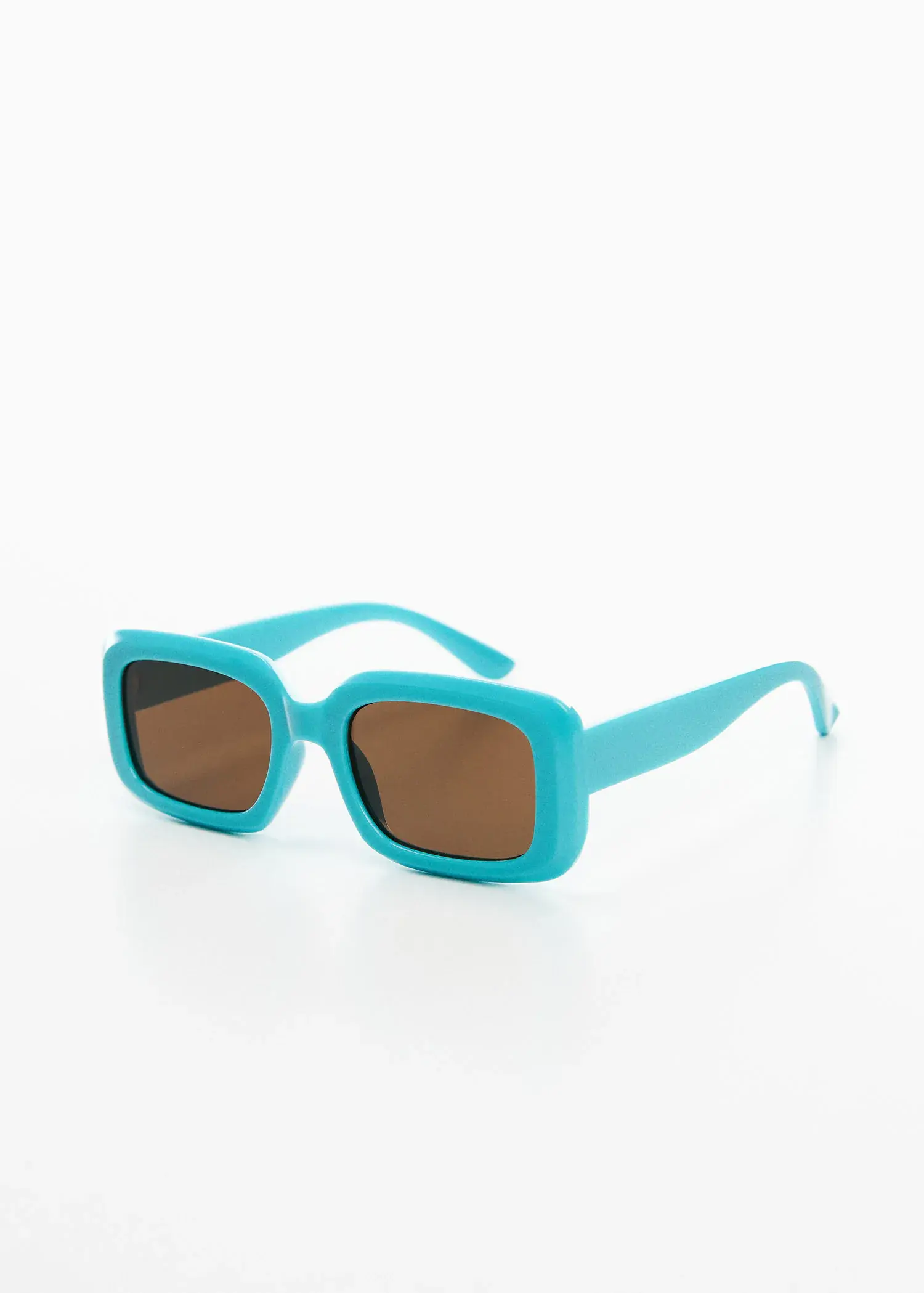 Mango Rectangular sunglasses. a pair of sunglasses sitting on top of a white table. 