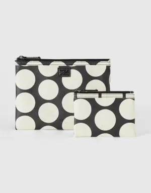two black bags with white polka dots
