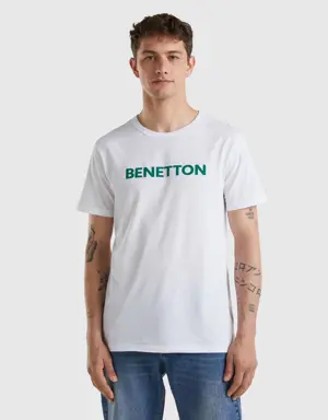 white t-shirt in organic cotton with green logo