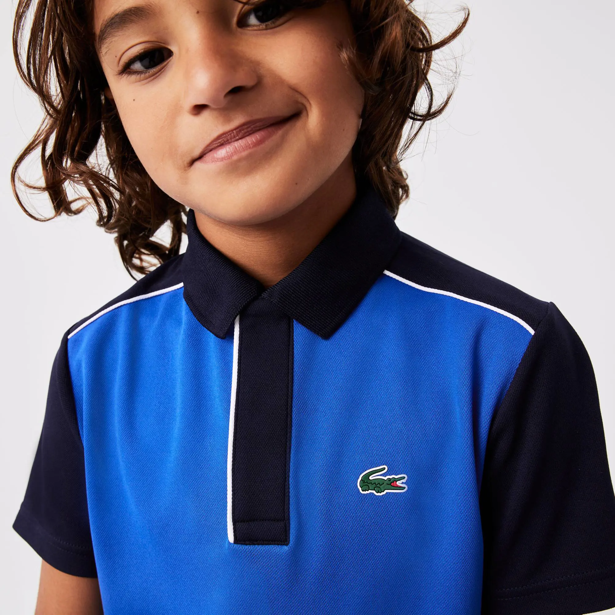 Lacoste Polo en piqué de secado rápido Lacoste SPORT para niños. 1