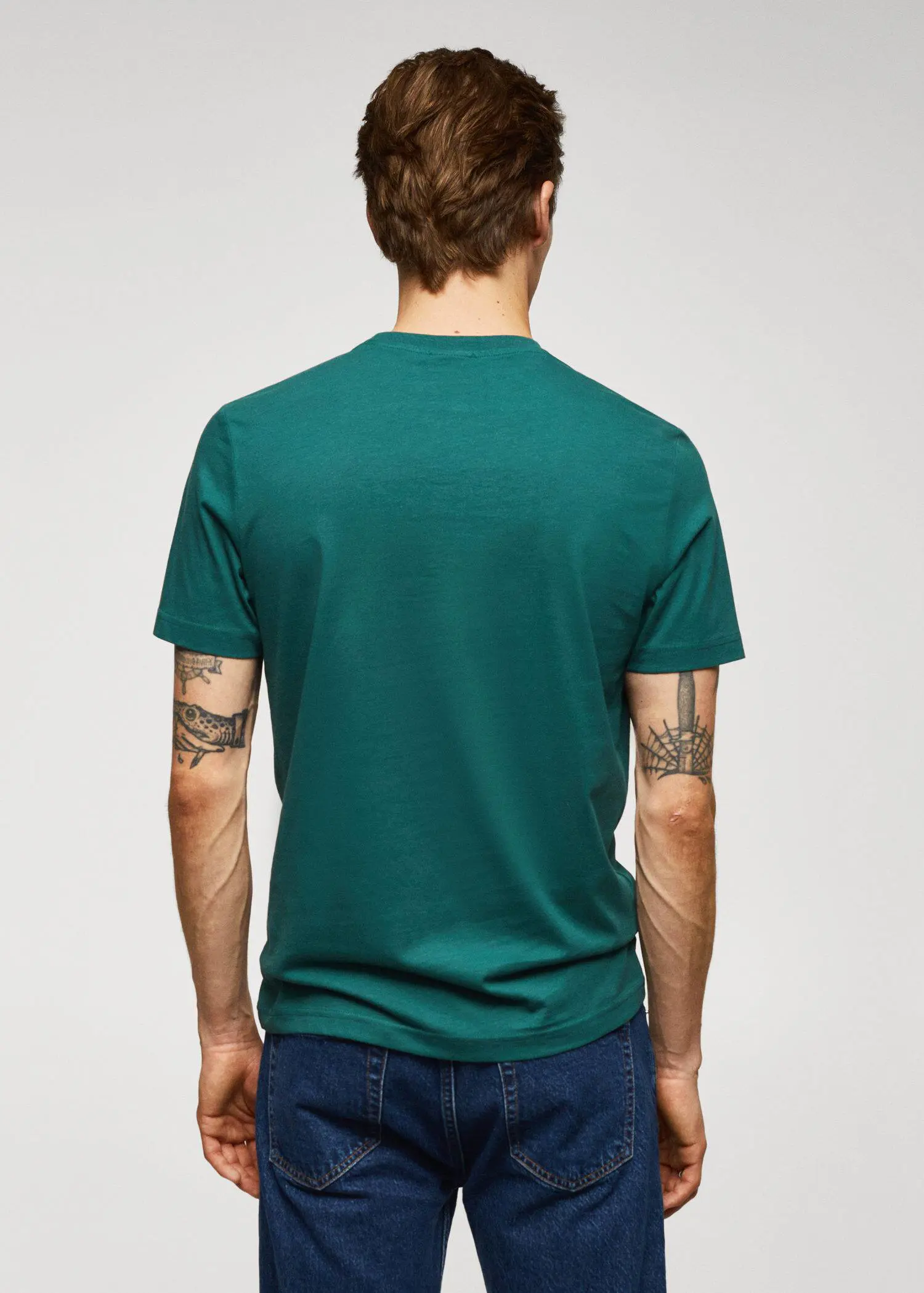Mango 100% cotton t-shirt with logo. a man wearing a t-shirt and jeans. 