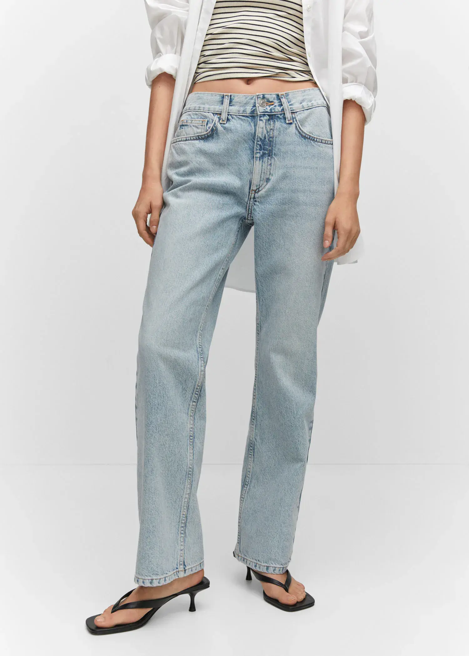 Mango Mid-rise straight jeans. a person wearing a pair of light blue jeans. 