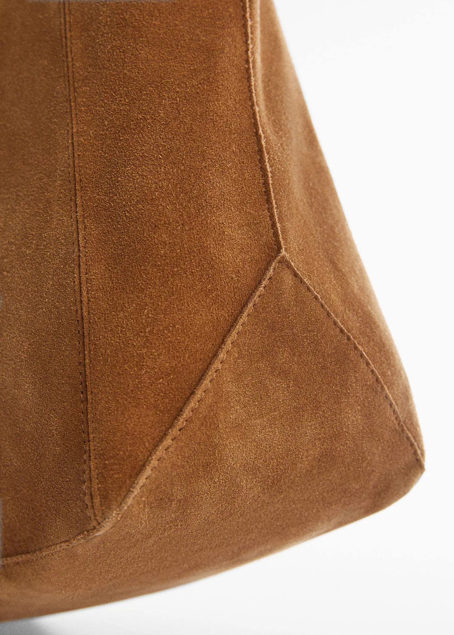 Mango Leather shopper bag. a close-up view of a brown purse. 