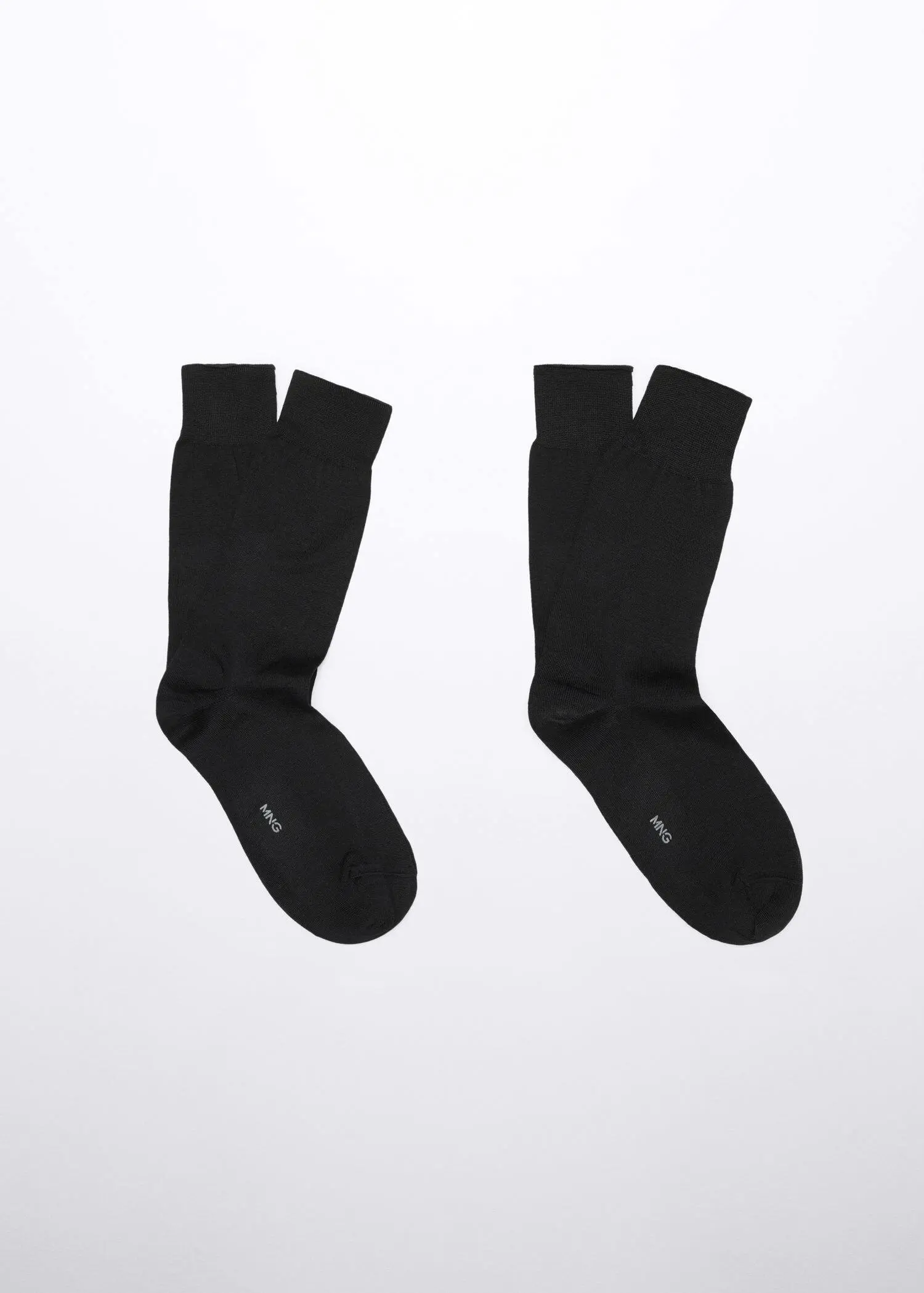 Mango 100% plain cotton socks. a pair of black socks on a white background. 