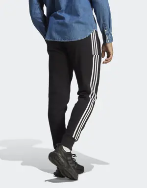 Adidas Calças Afuniladas em Moletão 3-Stripes Essentials. 3 Adidas Calças Afuniladas em Moletão 3-Stripes Essentials. 3