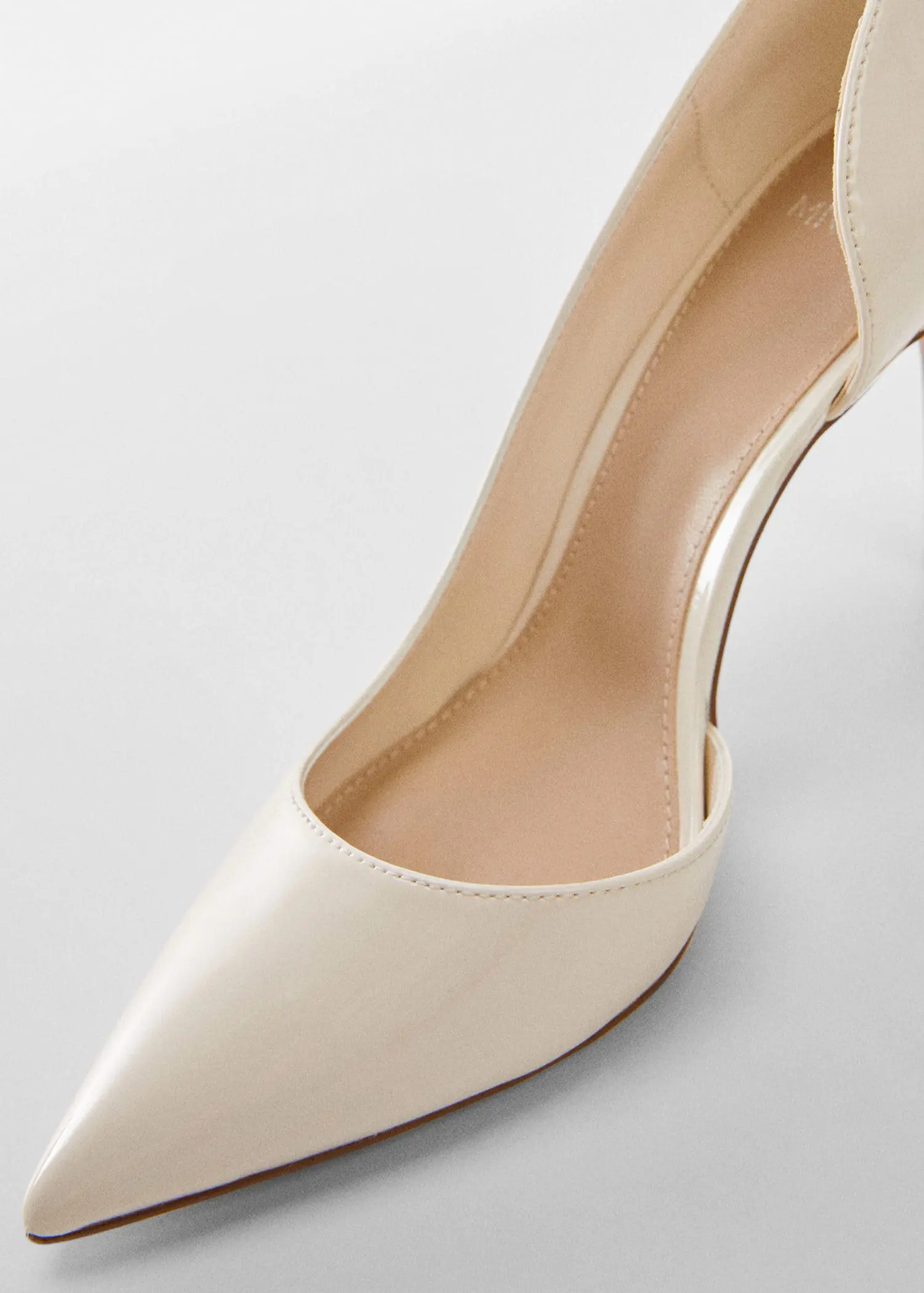 Mango Asymmetrical heeled shoes. a close-up of a pair of high heel shoes. 