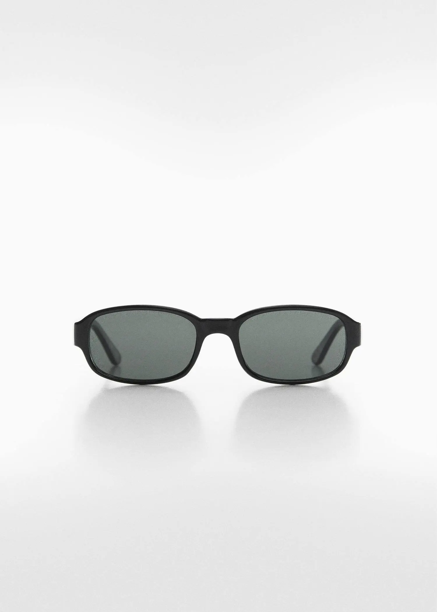 Mango Retro style sunglasses. a pair of sunglasses on a white surface. 