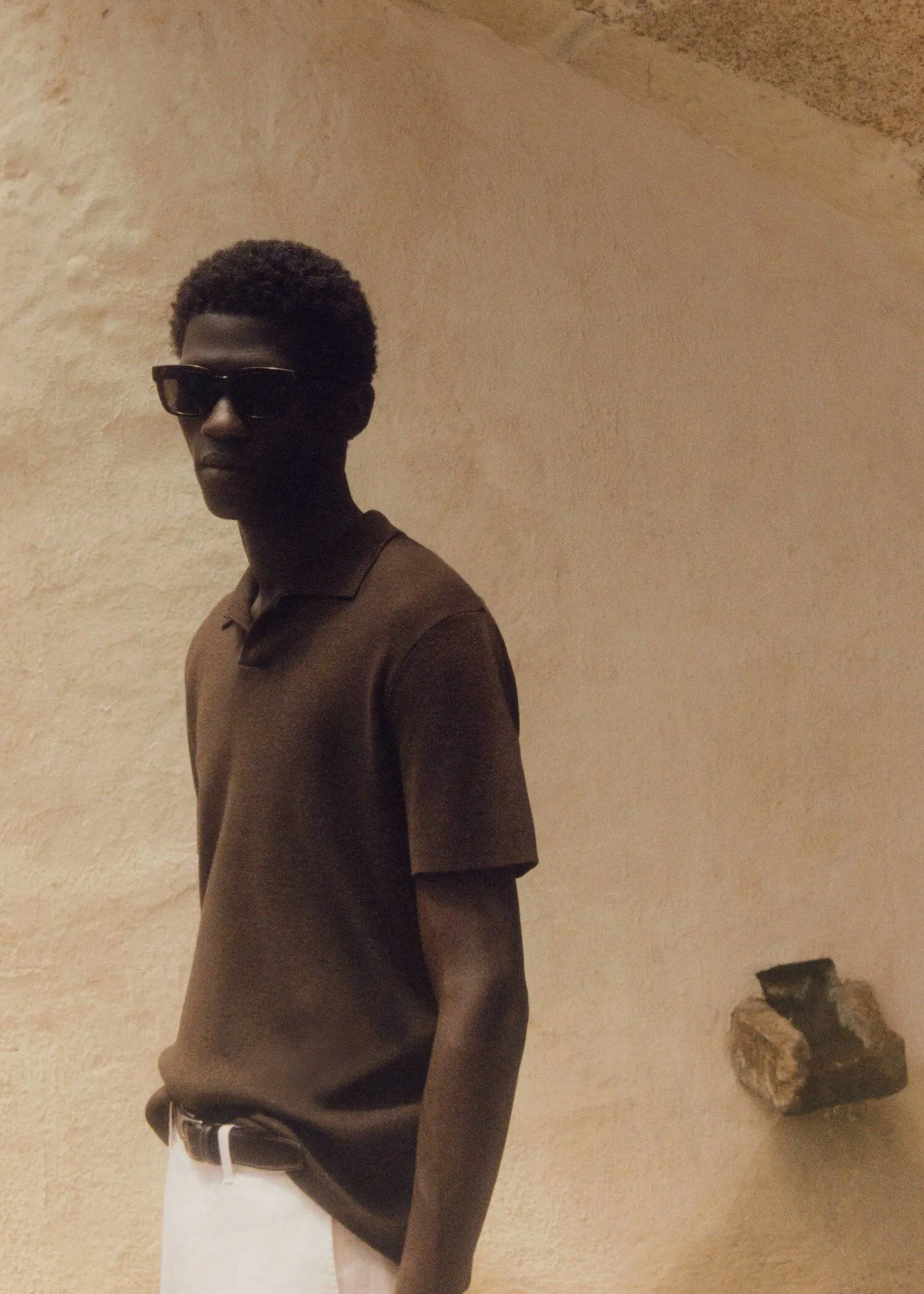 Mango Fine-knit polo shirt. a young man wearing sunglasses and a brown shirt. 
