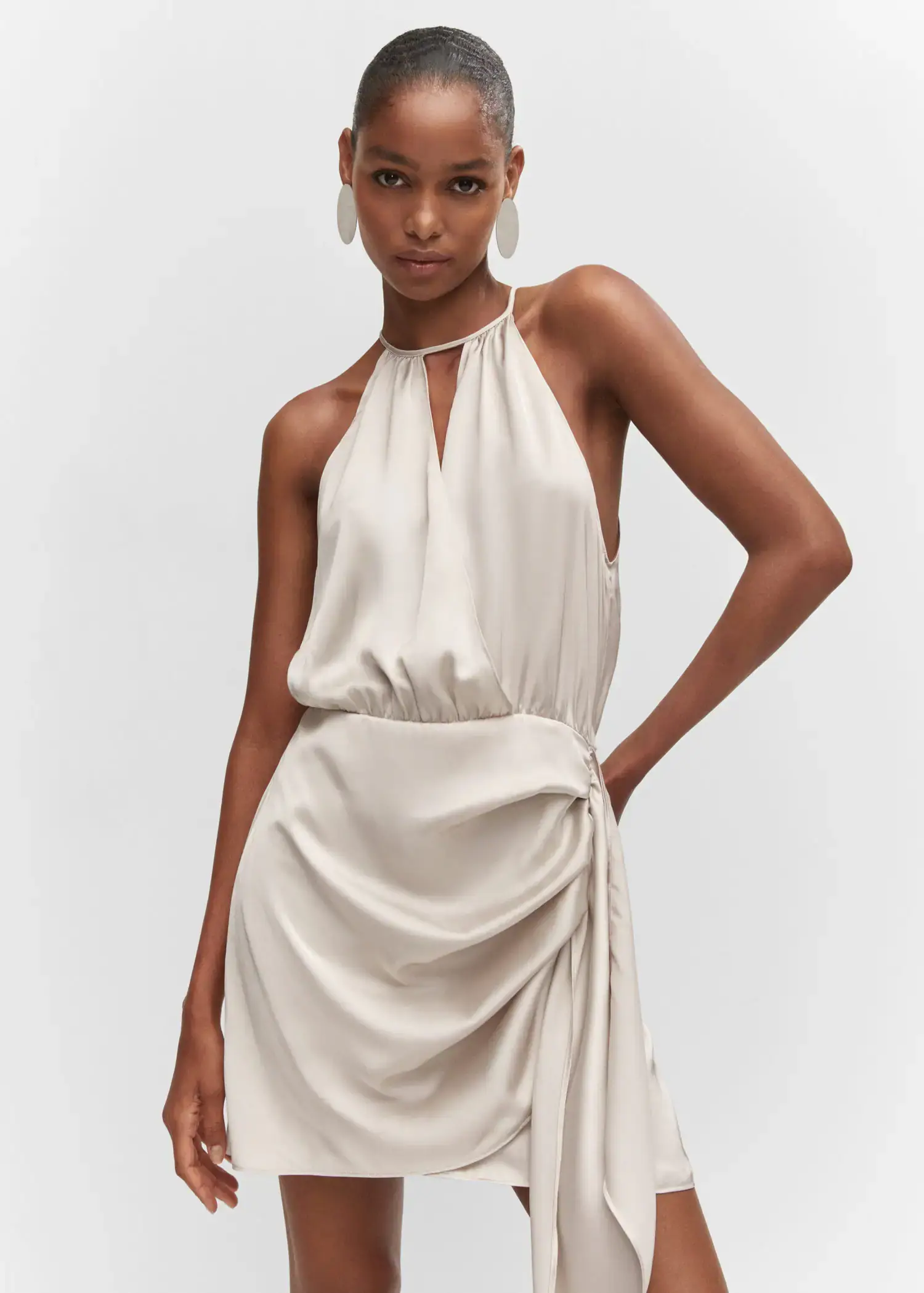 Mango Satin halter neck dress. a woman in a white dress posing for a picture. 