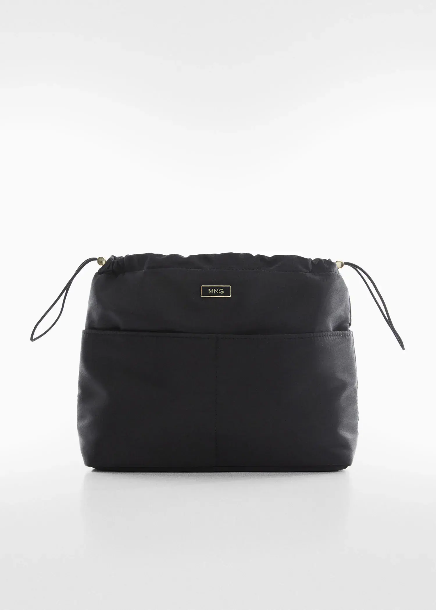 Mango Leather bowling bag. a black bag sitting on top of a white table. 
