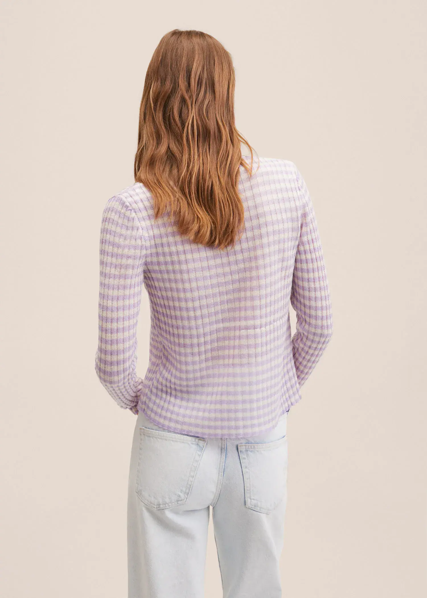 Mango Knitted cropped cardigan. a woman wearing a purple and white checkered jacket. 
