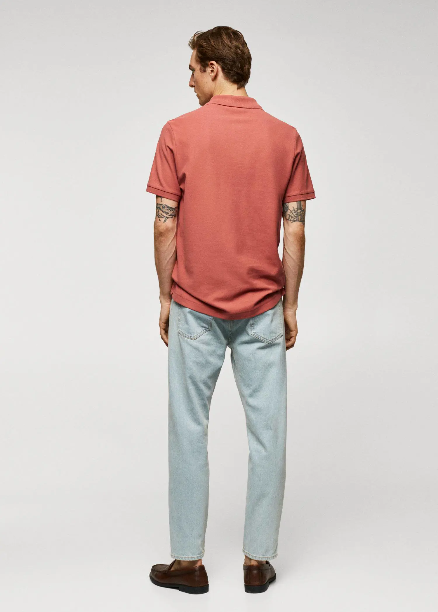 Mango 100% cotton pique polo shirt. a man wearing a red shirt and blue pants. 