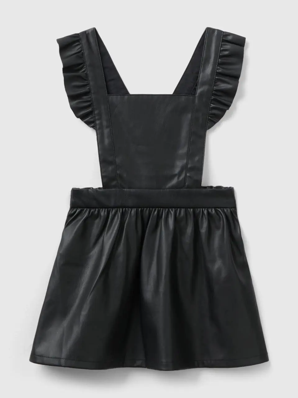 Benetton overall skirt in imitation leather fabric. 1