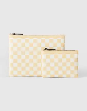 two bags with white and yellow checkers