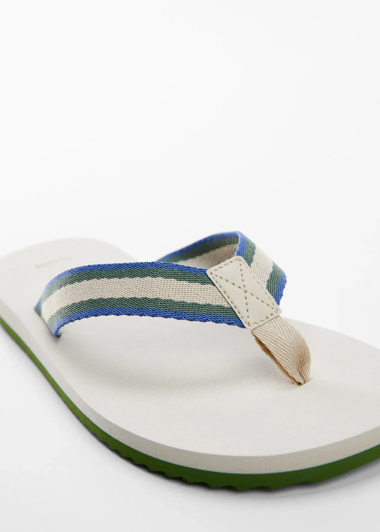 Mango Flip-flops with contrasting color straps. a close up of a pair of flip flops. 