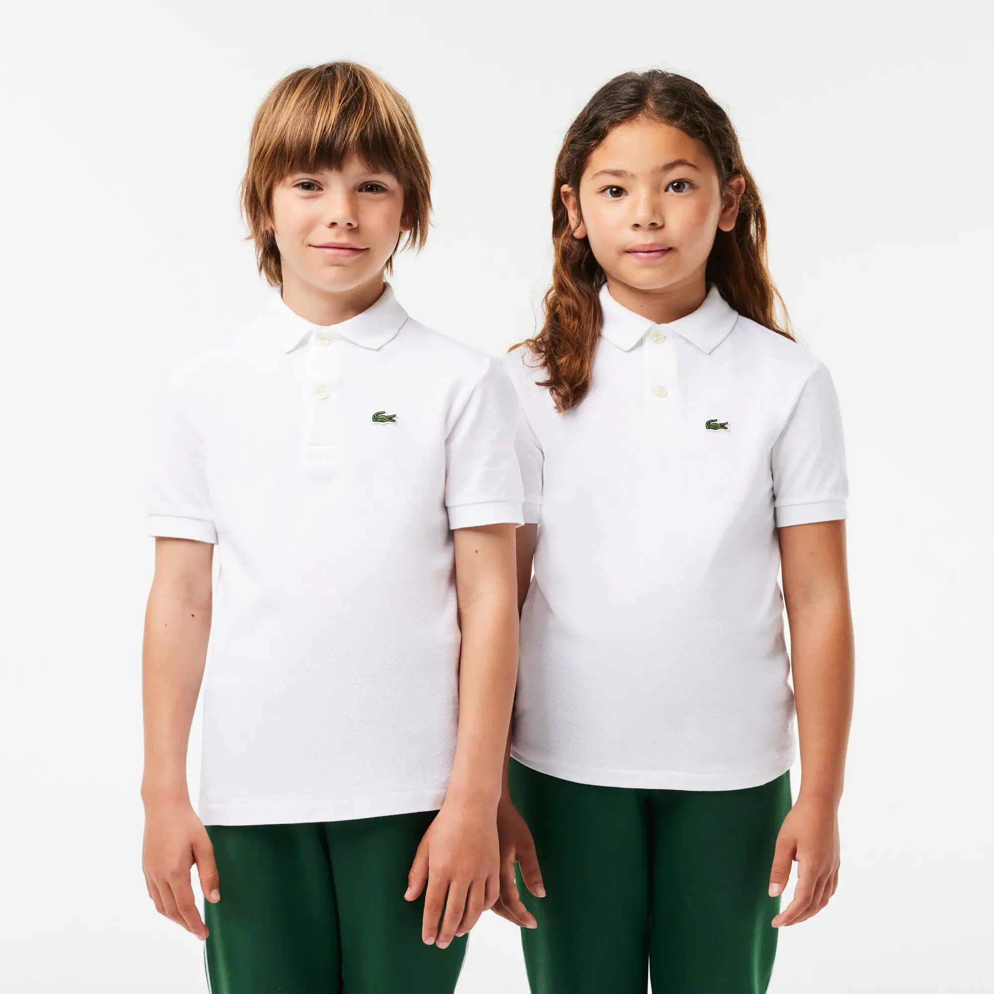 Lacoste Kids' Regular Fit Petit Piqué Polo. 1