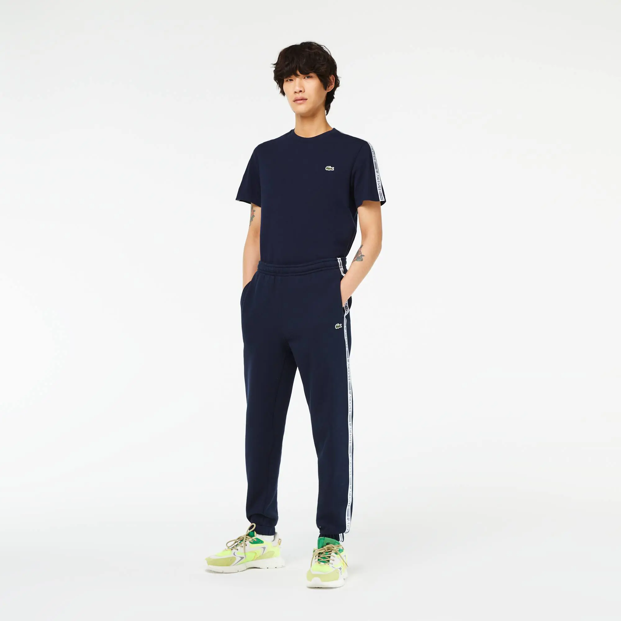 Lacoste Pantalon de survêtement Jogger homme Lacoste avec bandes siglées. 1