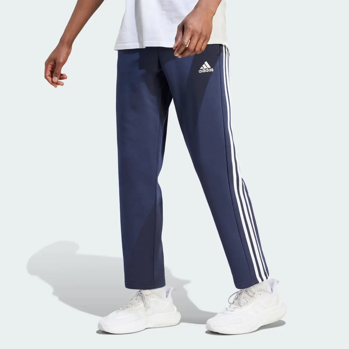 Adidas Essentials 3-Stripes Open Hem Fleece Pants. 1