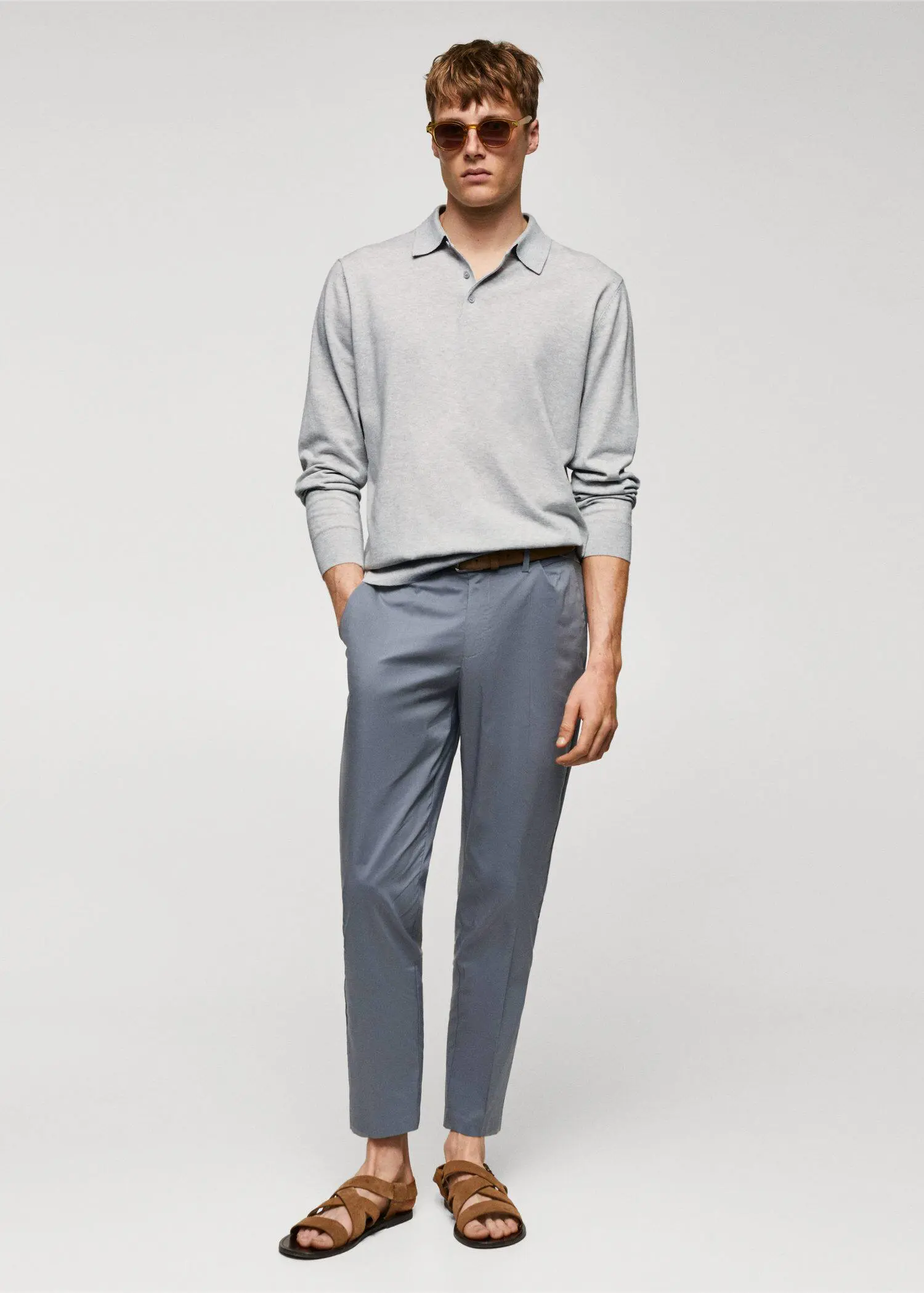 Mango Long-sleeved cotton jersey polo shirt. a man in a gray shirt and blue pants. 