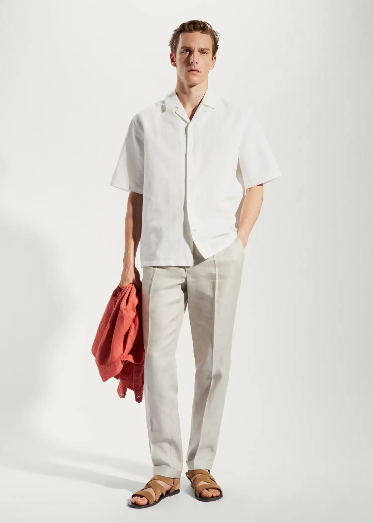 Mango Cotton-linen bowling-collar shirt. a man in a white shirt and beige pants. 