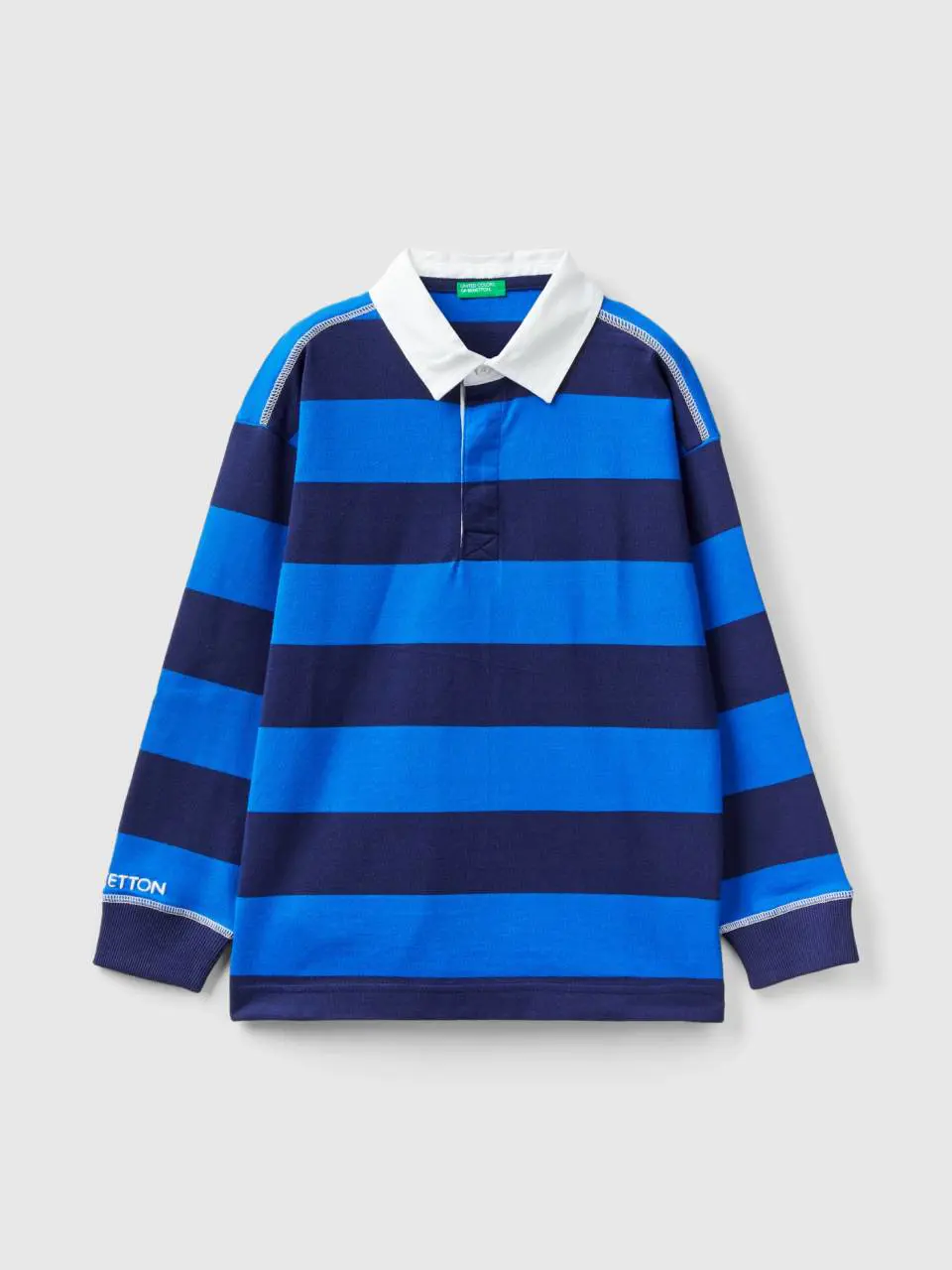 Benetton rugby polo with cornflower blue and dark blue stripes. 1