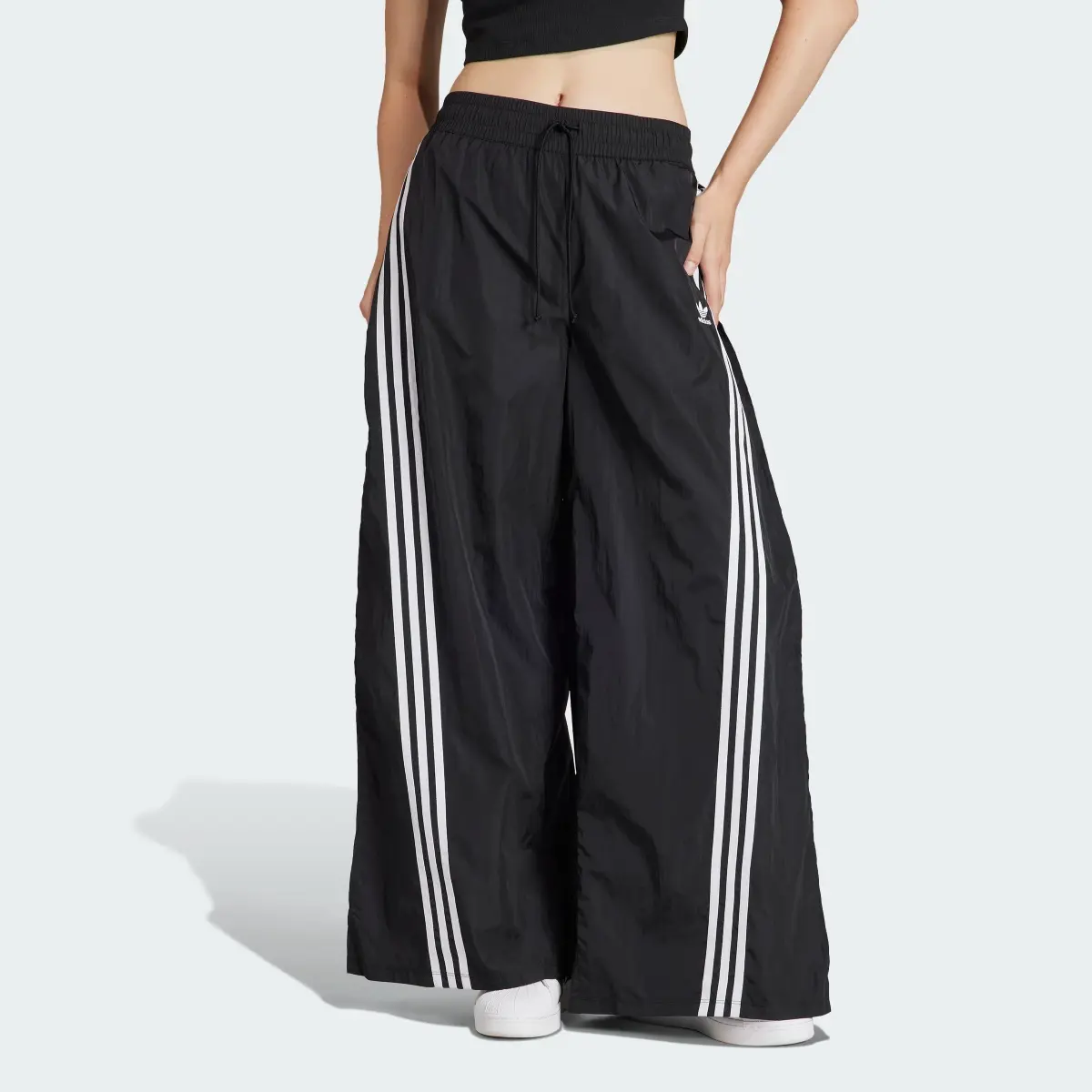 Adidas Track pants adilenium Mega Flared. 1