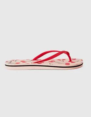light pink flip flops with cherry pattern