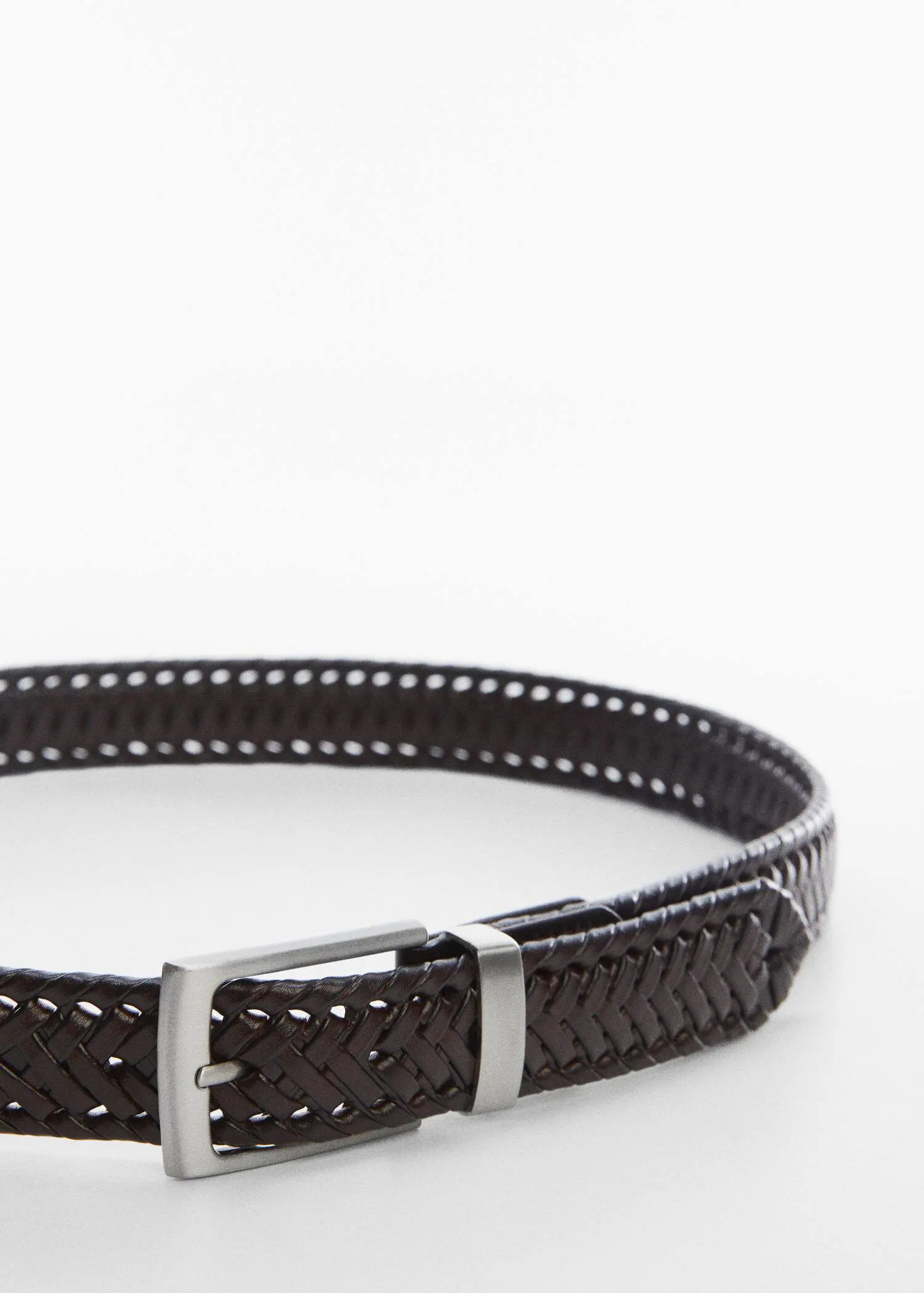 Mango Braided leather belt. a close-up of a brown leather belt with a silver buckle. 