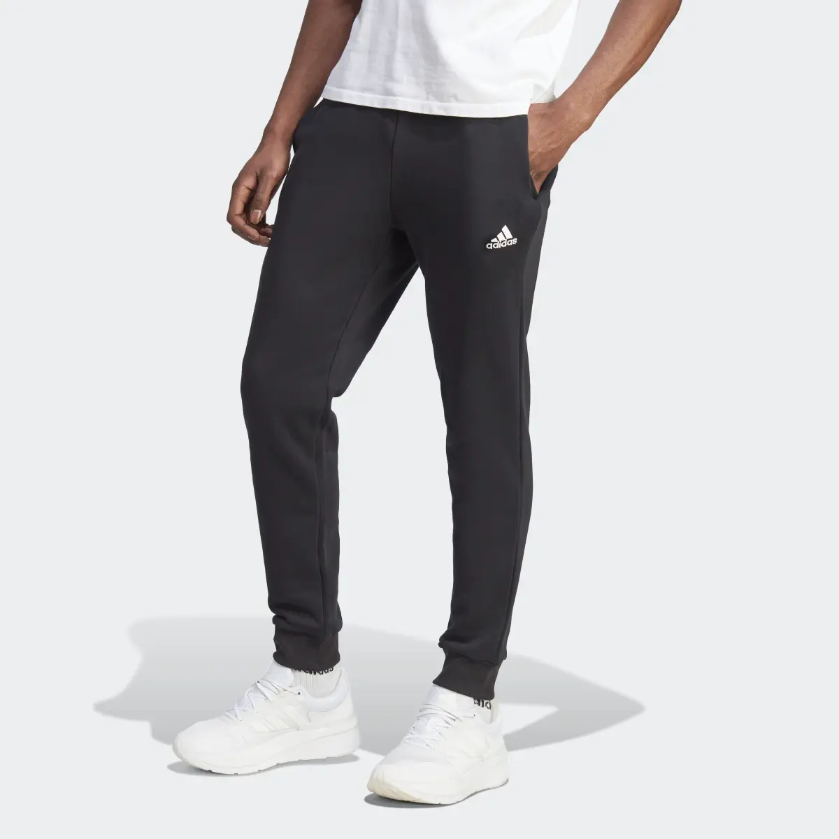 Adidas Essentials Fleece Tapered Cuffed Pants. 1