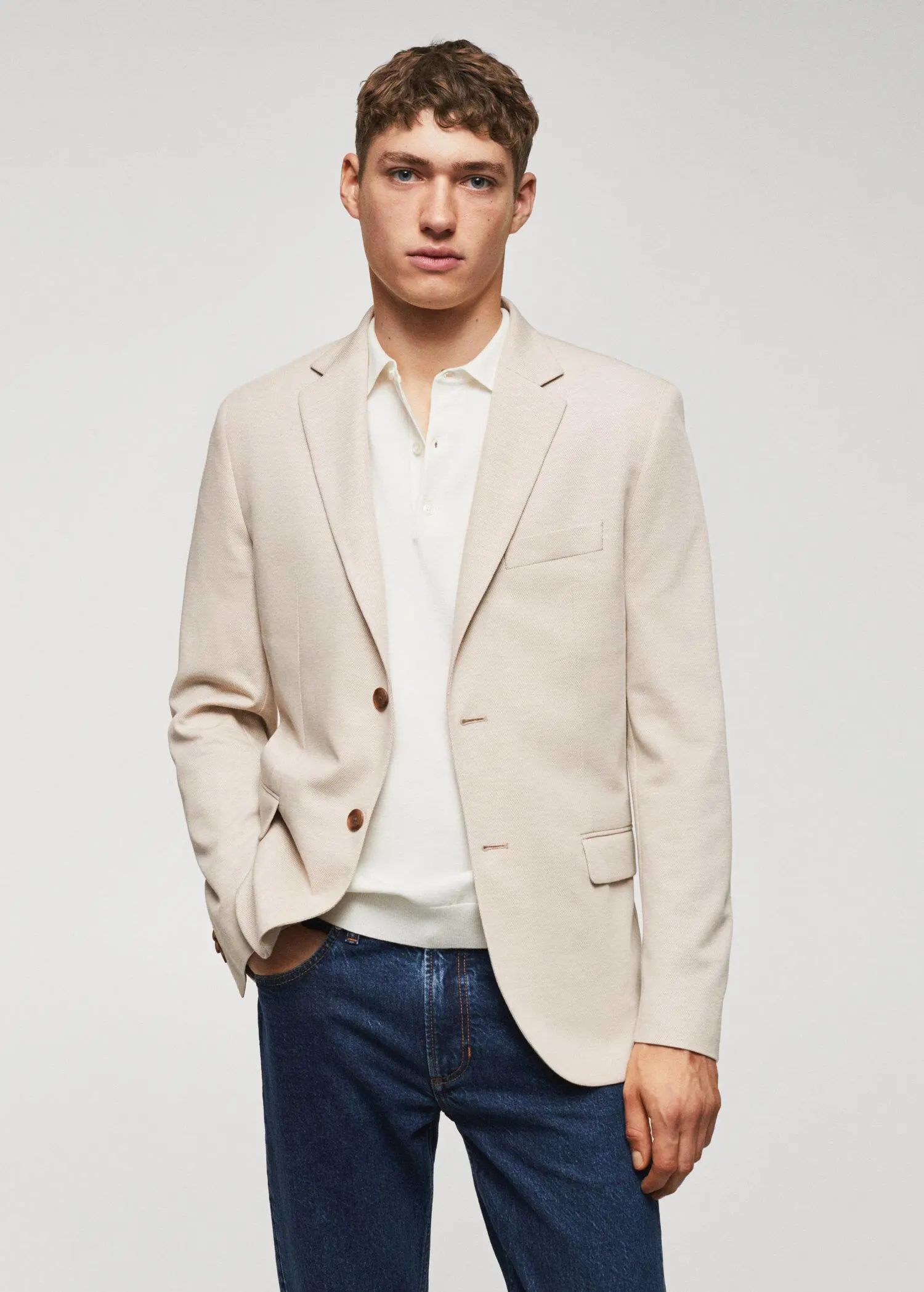 Mango Slim fit microstructure blazer. a man wearing a white shirt and a beige jacket. 