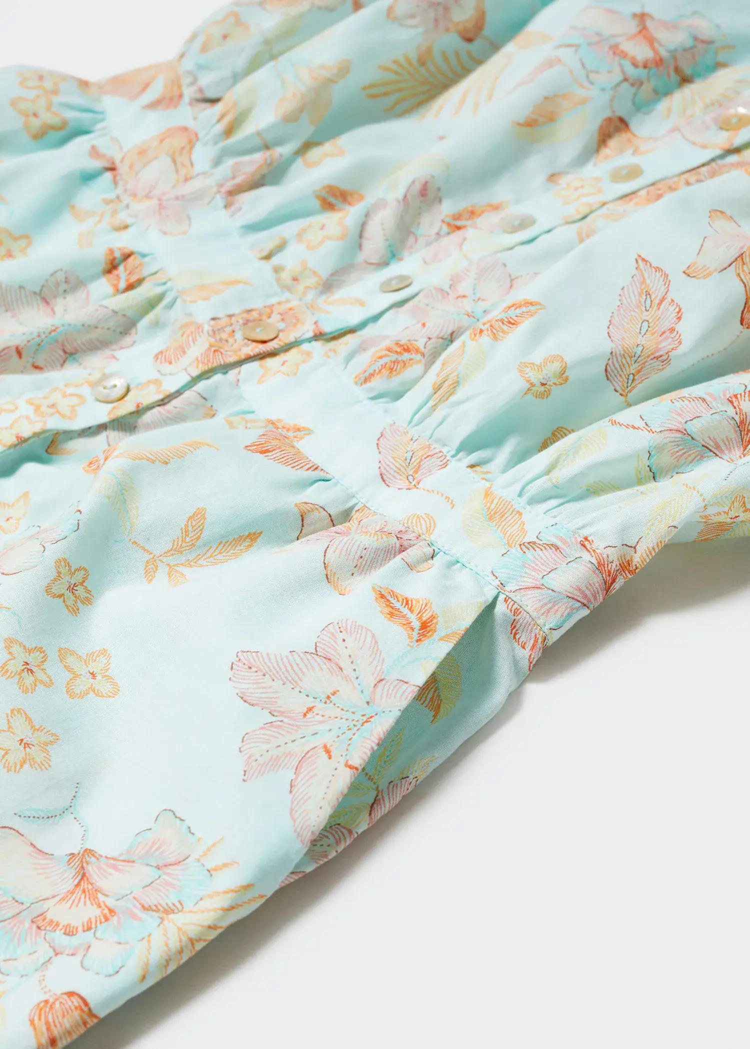 Mango Printed short jumpsuit. a close-up view of a floral pattern. 