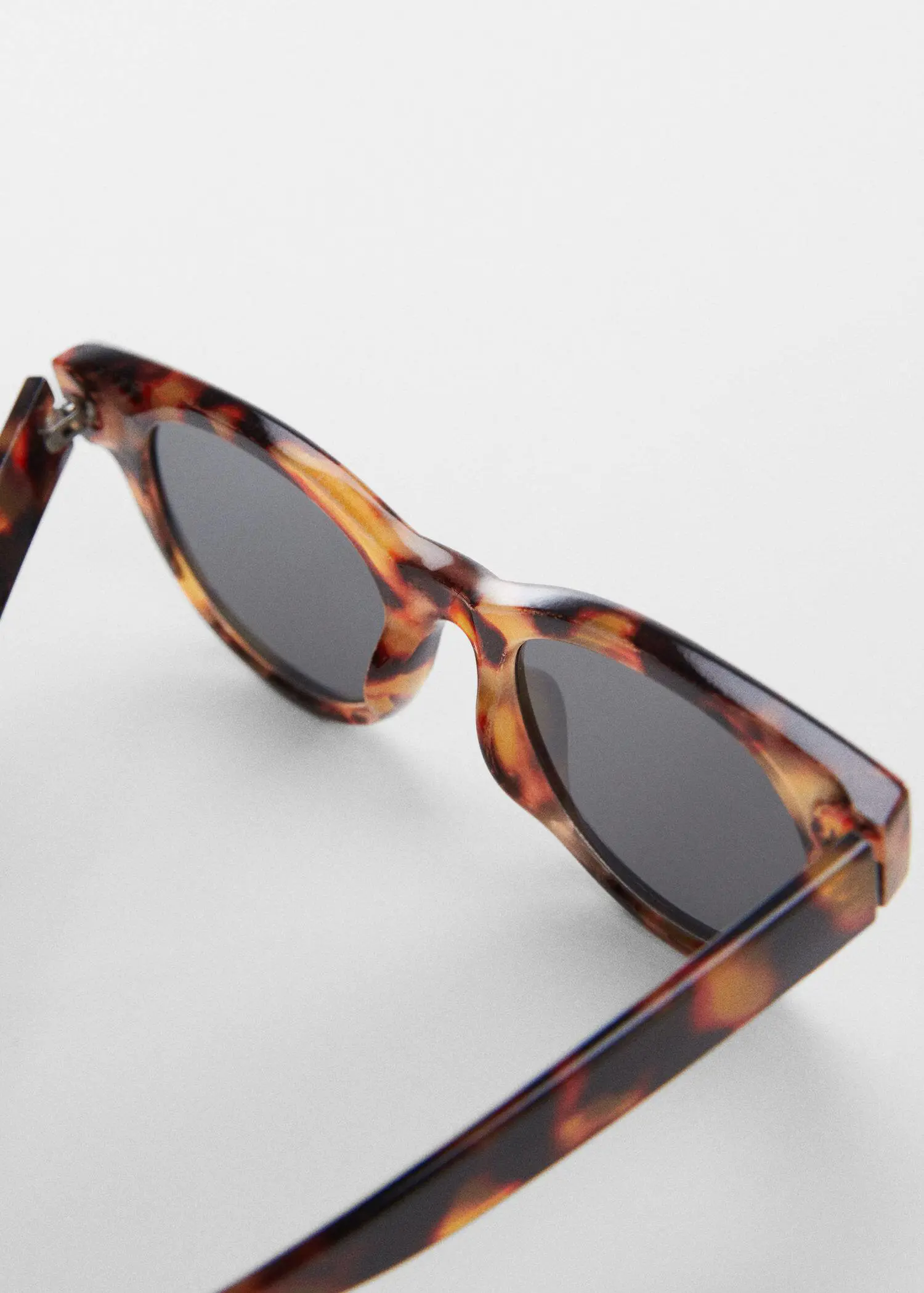 Mango Tortoiseshell sunglasses. a close up of a pair of sunglasses. 