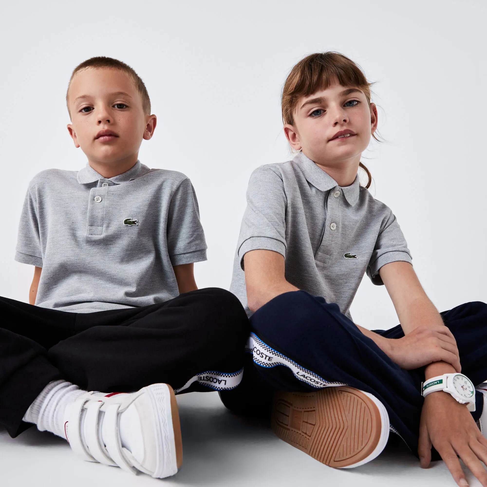 Lacoste Kids' Regular Fit Petit Piqué Polo. 1