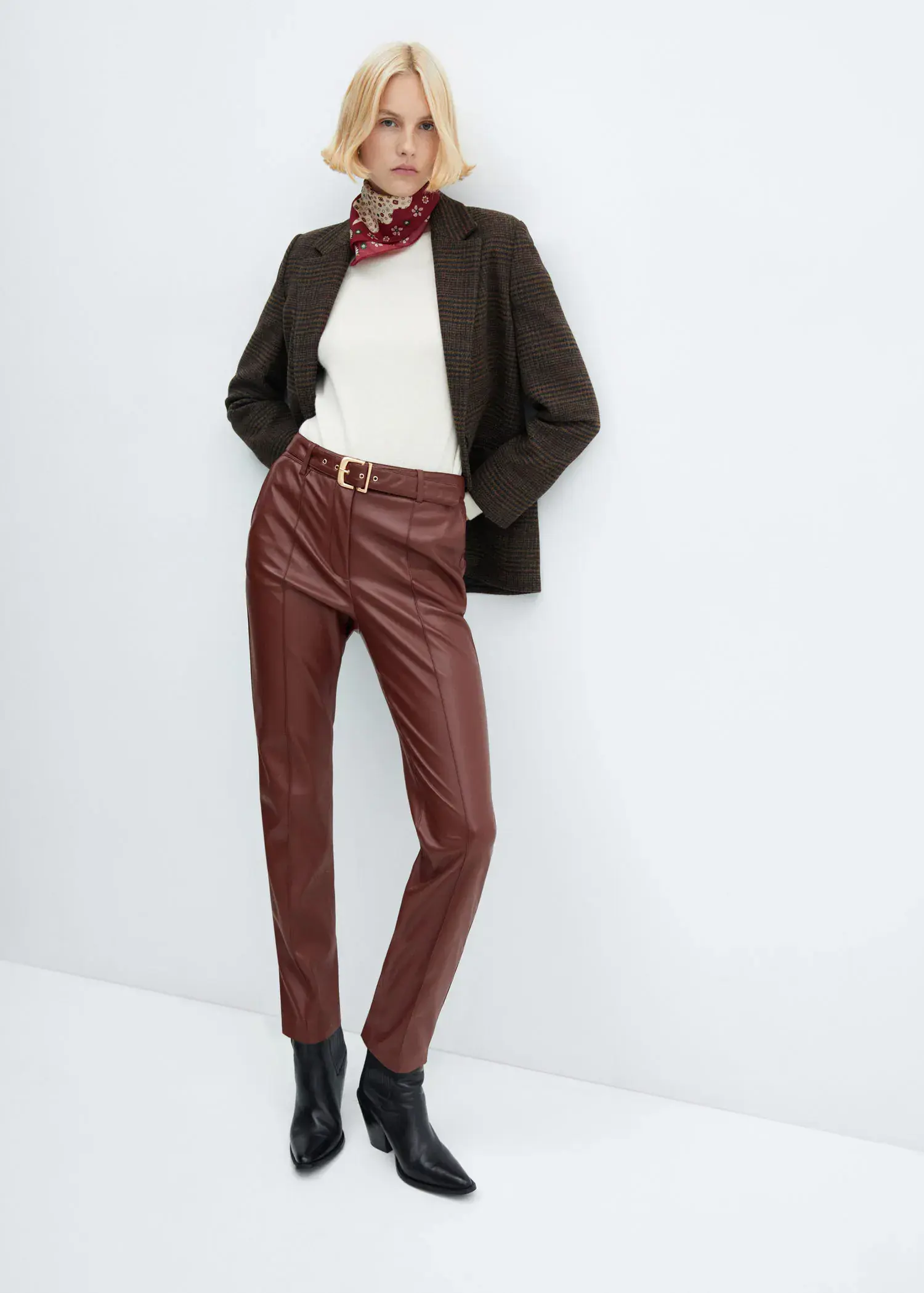 Mango Leather-effect trousers with belt. 1