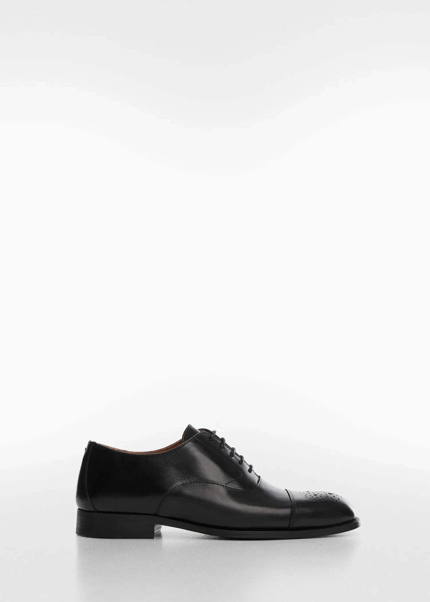 Mango Laser-cut leather blucher shoes. a pair of black shoes on a white background. 
