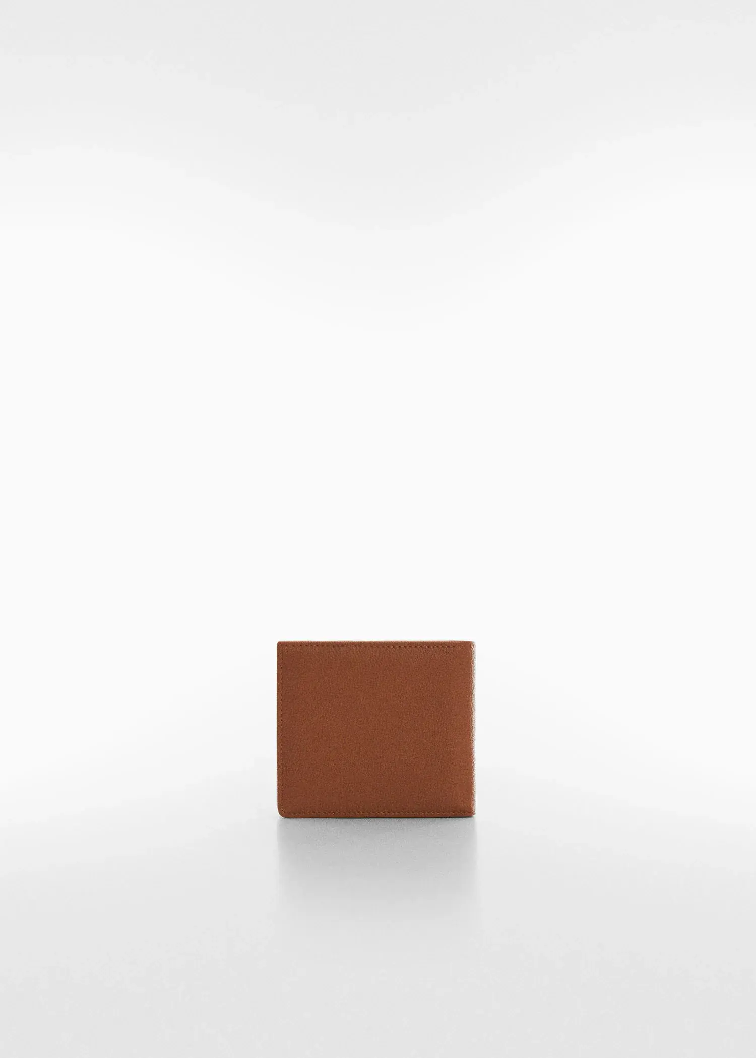 Mango Anti-contactless wallet. a brown square object on top of a white surface. 