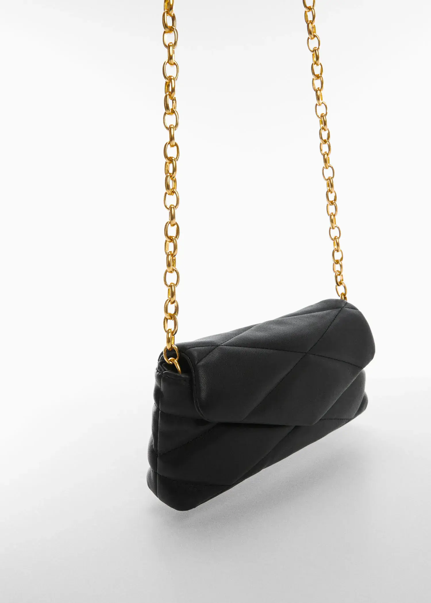 Mango Quilted chain bag. a black purse with a gold chain strap. 
