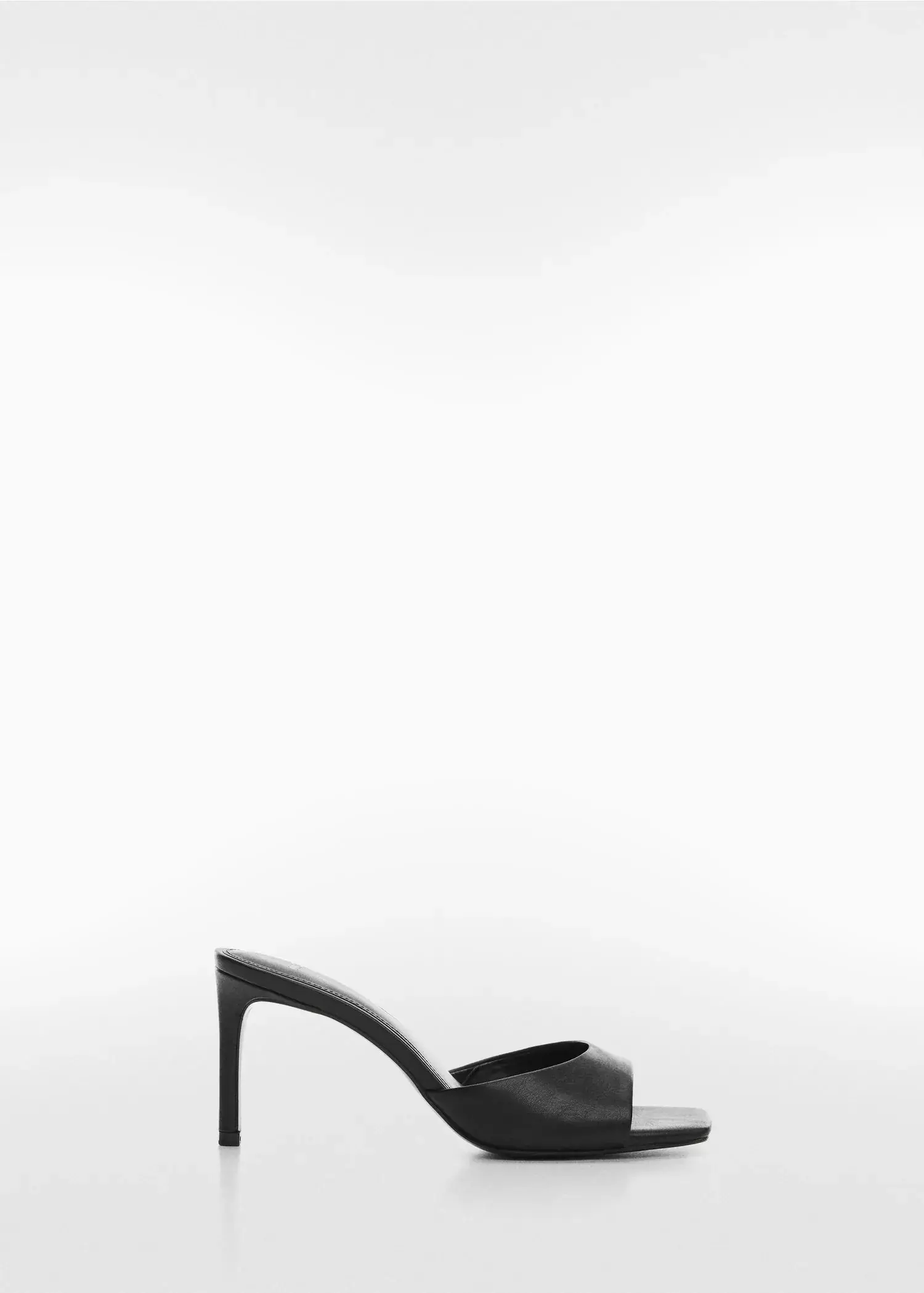 Mango Strappy heeled sandals. a pair of black high heeled shoes on a white background. 