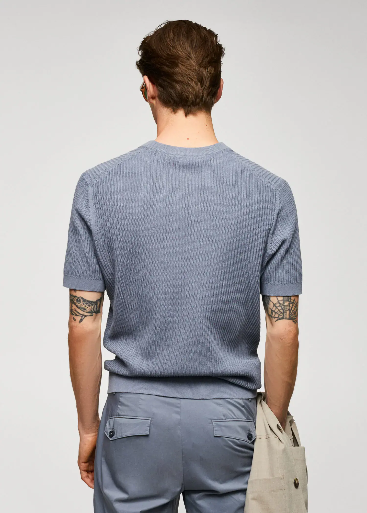 Mango 100% cotton t-shirt with ribbed structure. a man with a tattoo on his arm. 