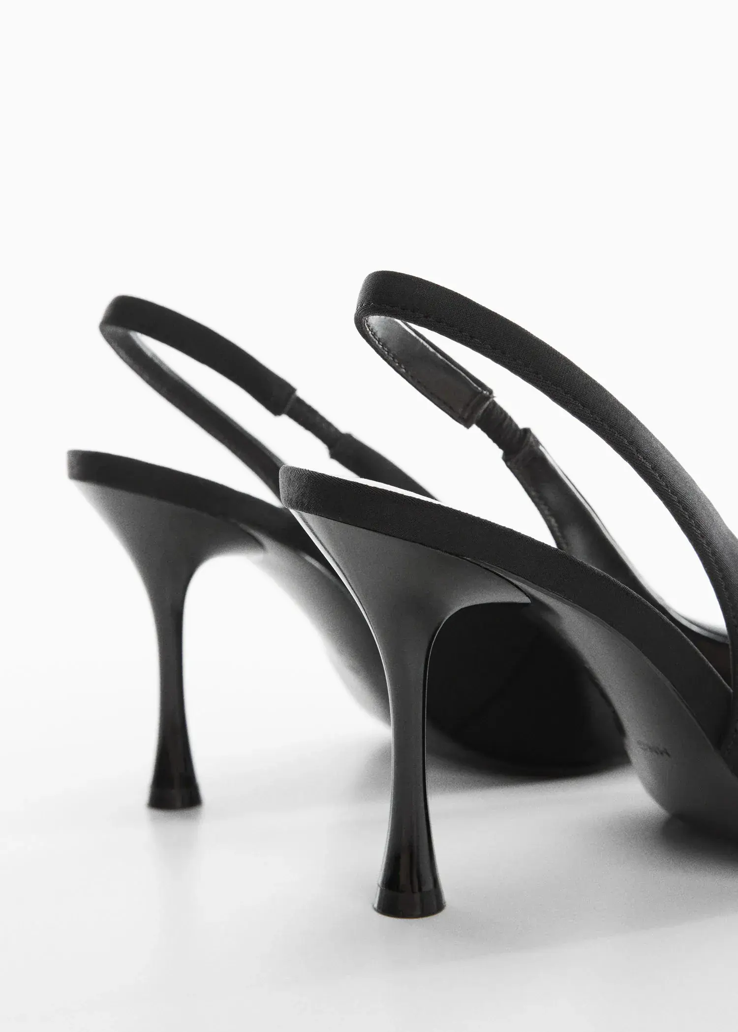 Mango High-heeled shoes. a close up of a pair of black high heels 