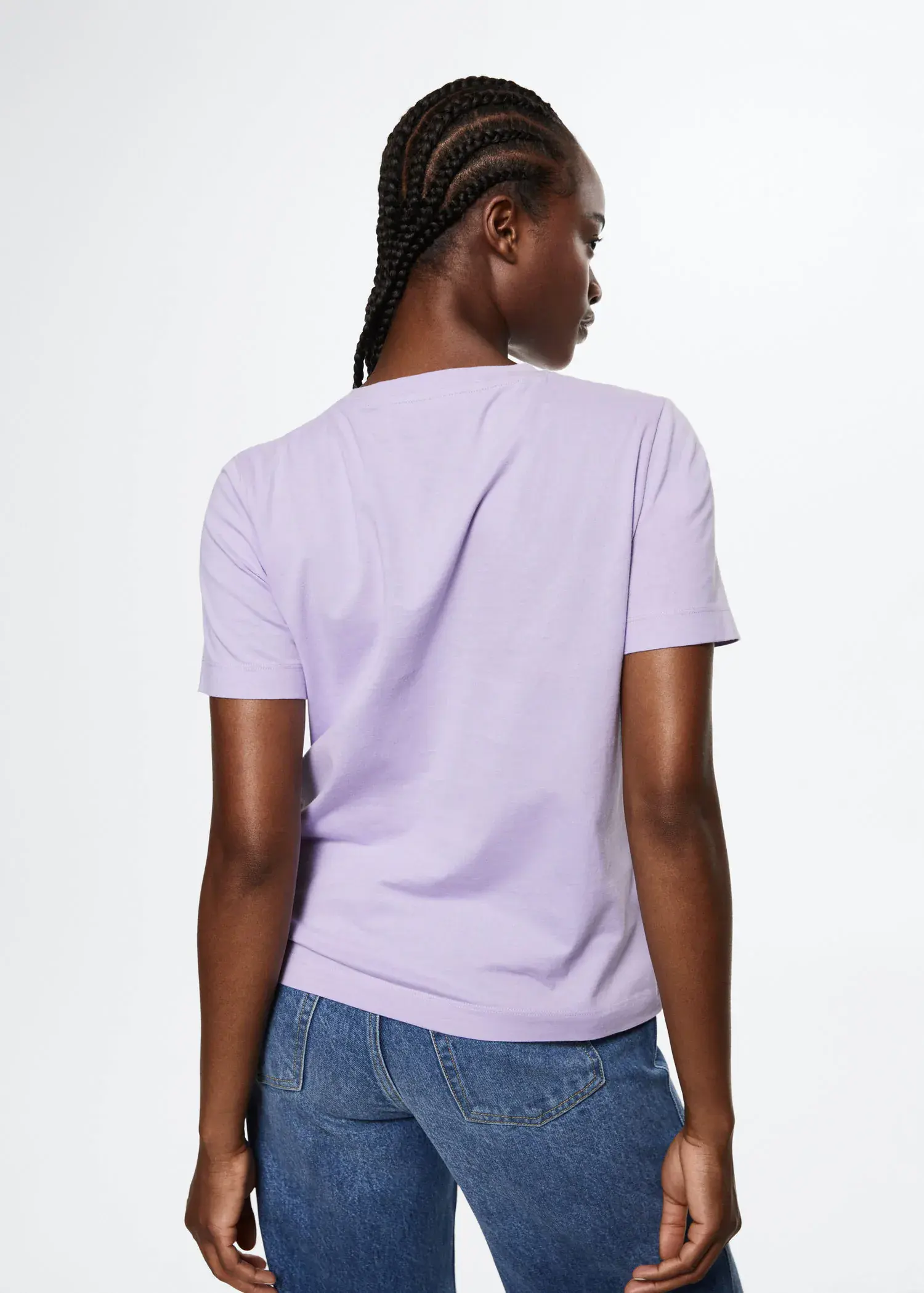 Mango 100% cotton T-shirt. a person wearing a purple shirt and jeans. 