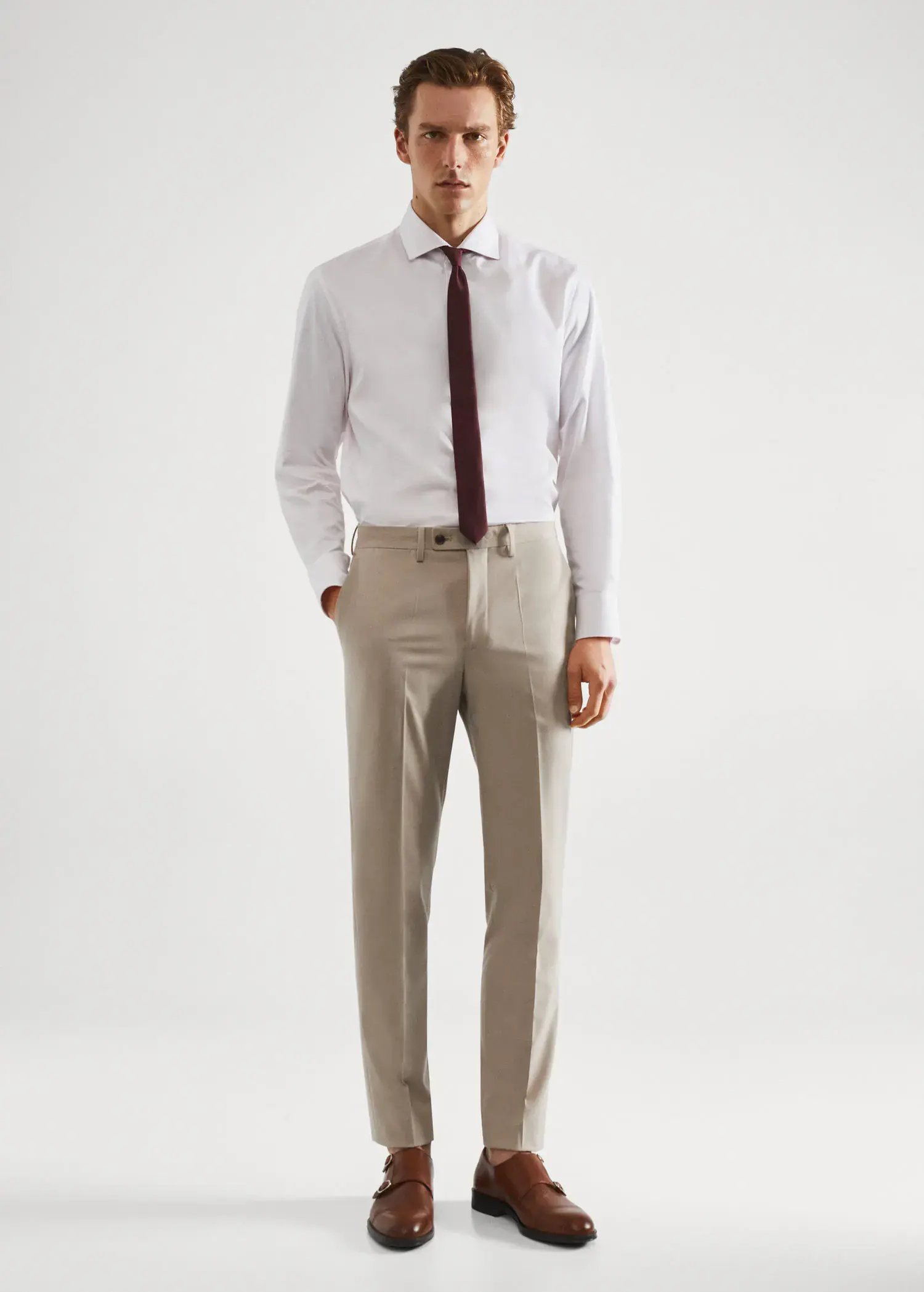 Mango Stretch fabric slim-fit suit pants. a man in a white dress shirt and tie. 