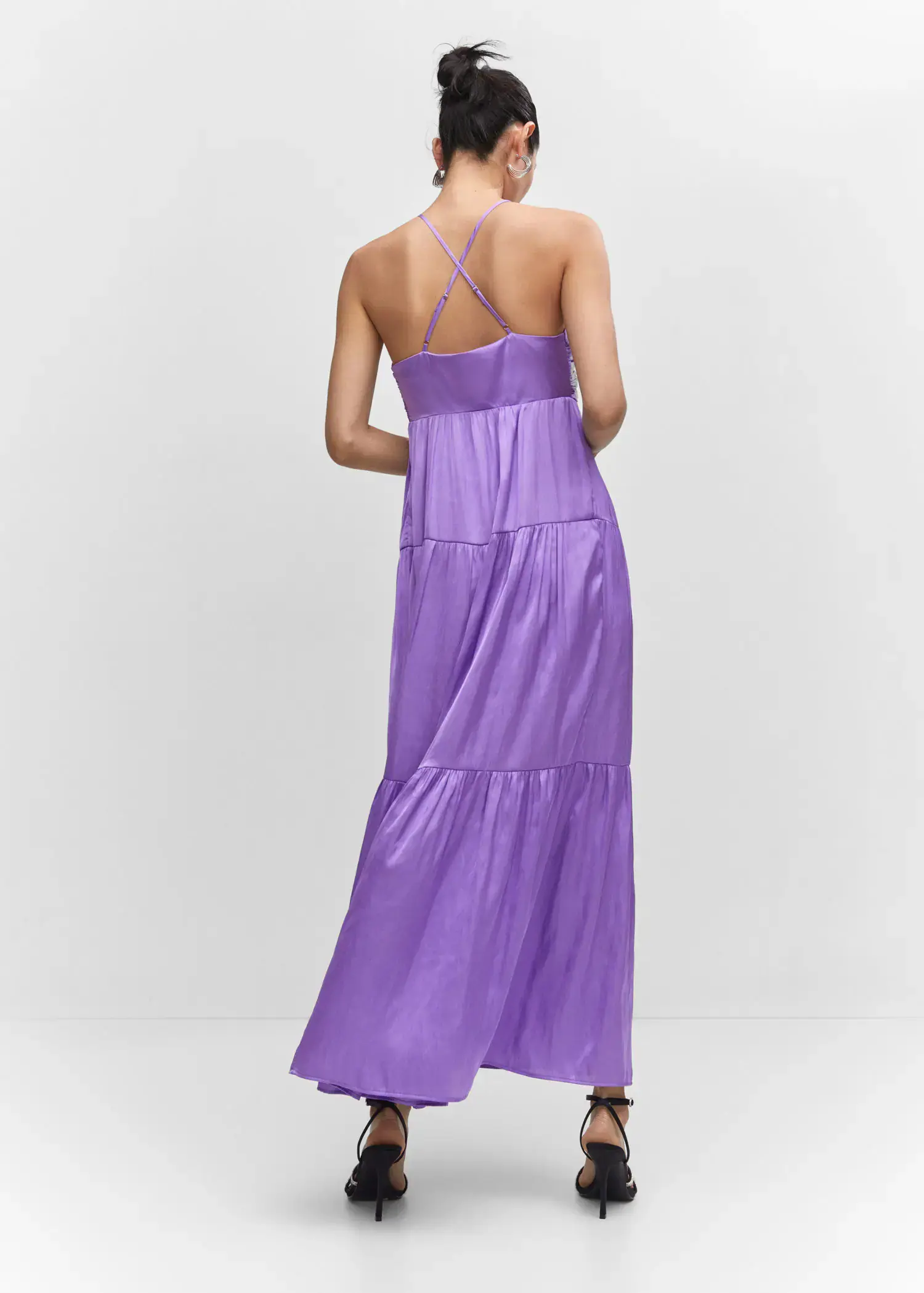 Mango Ruched satin dress. a woman wearing a long purple dress standing next to a wall. 
