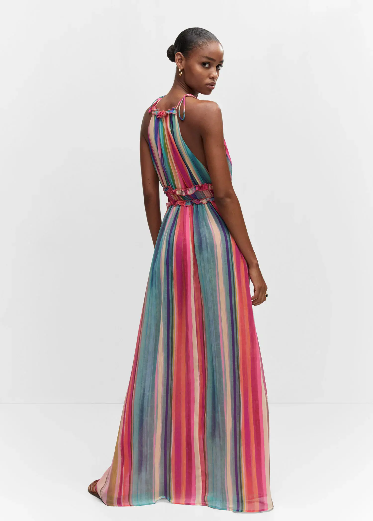 Mango Striped long dress. a woman wearing a long colorful striped dress. 