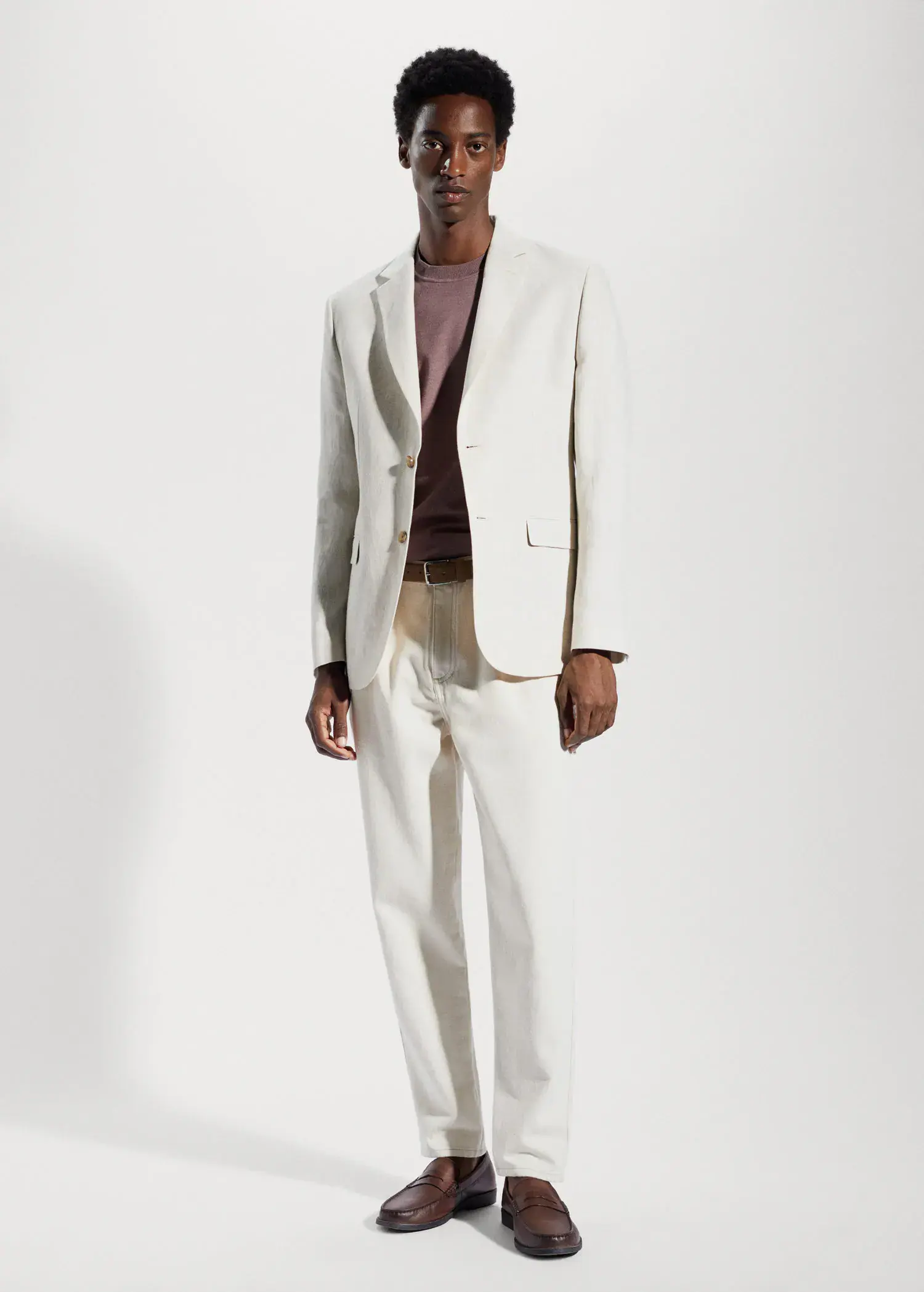 Mango 100% linen slim fit blazer. a man in a white suit standing in front of a white wall. 