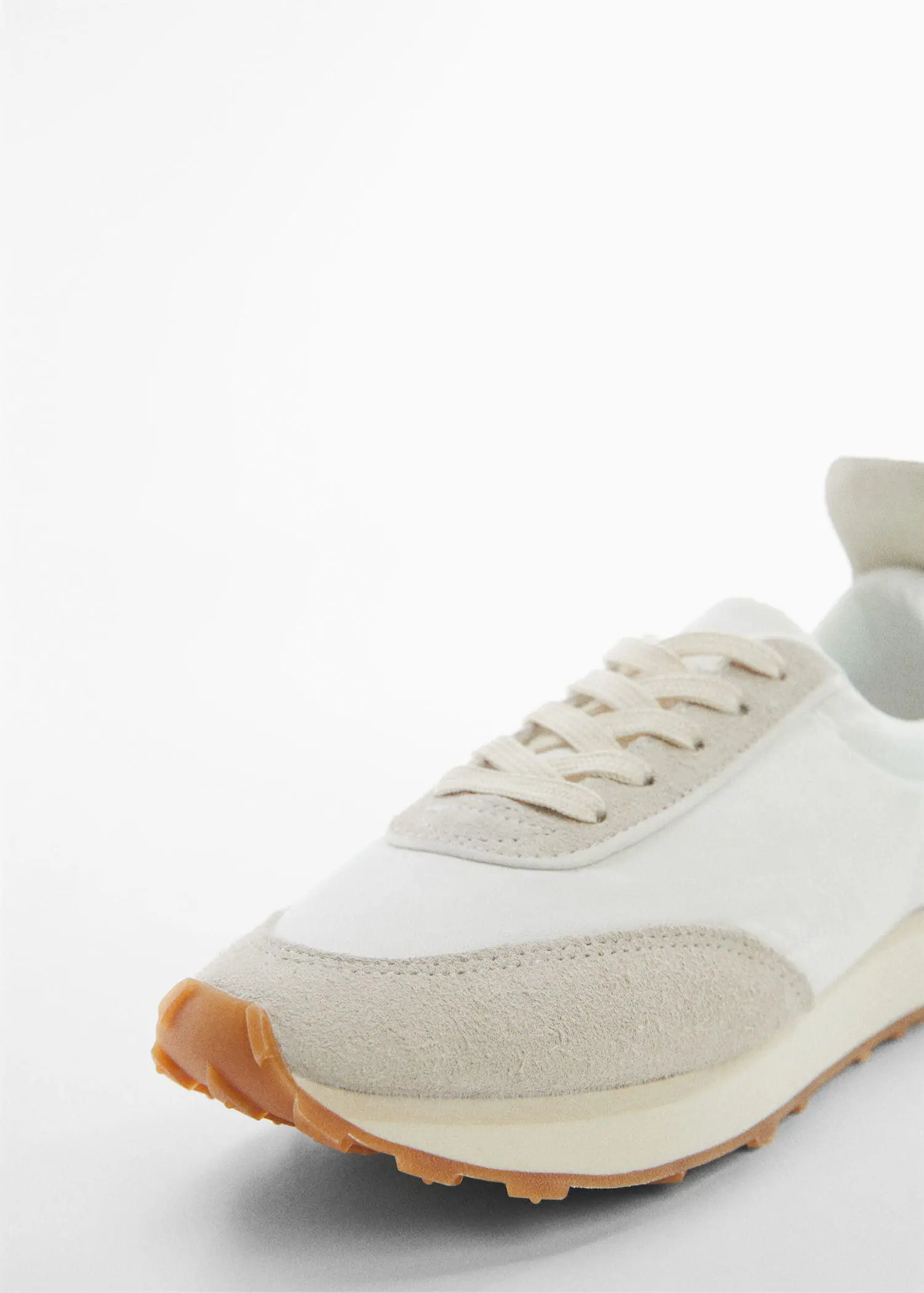 Mango Contrast panel sneakers. a close up view of a pair of white sneakers. 